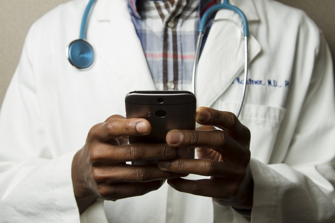 A clinician reviewing patient information — our pharmacists take it from here after you upload